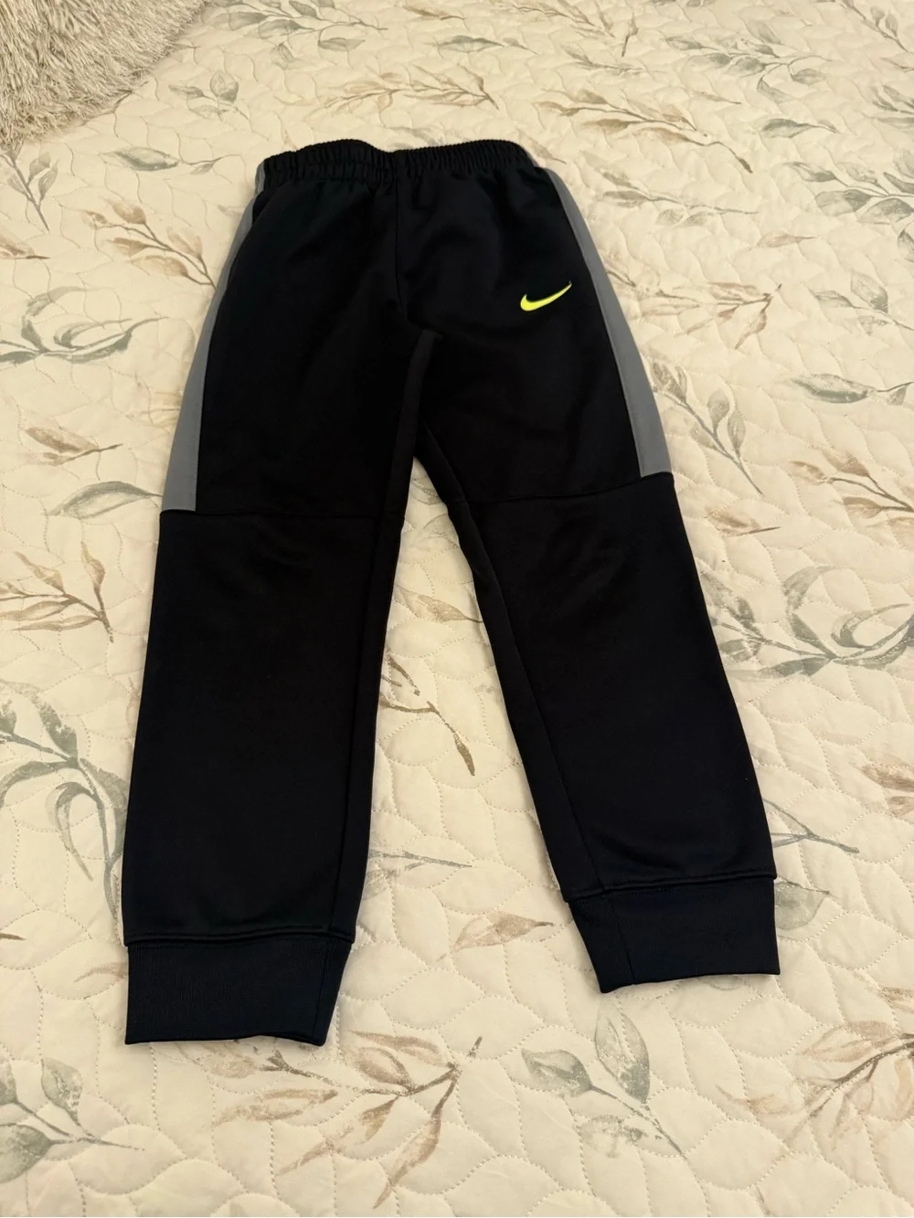 Nike Kids Black Joggers with Grey Side Panel and Neon Yellow Swoosh boy size 7 .